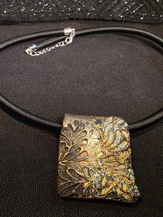 Jewelry - Black Cord Necklace with Gold Textured Floral Pendant